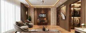 Camera da letto in stile quiet luxury con arredi su misura in legno scuro, cabina armadio illuminata, poltrone dal design morbido, illuminazione integrata e finiture di pregio dai toni neutri.